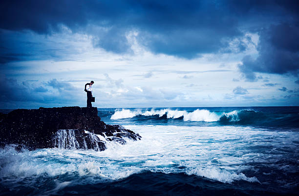 istock Depressed Businessman Standing by the Sea 499001071