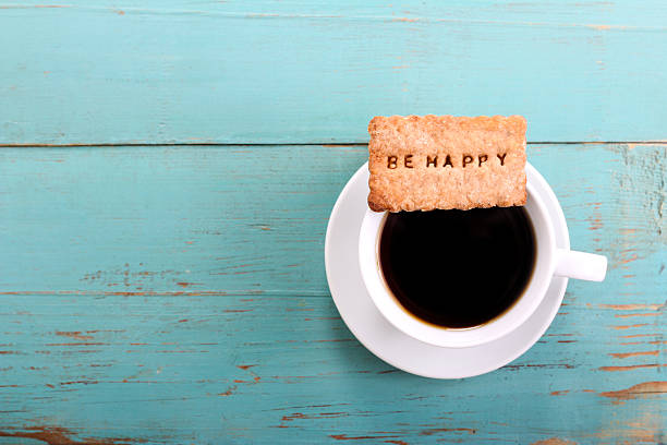 istock Cup of coffee and biscuit with be happy 499002962
