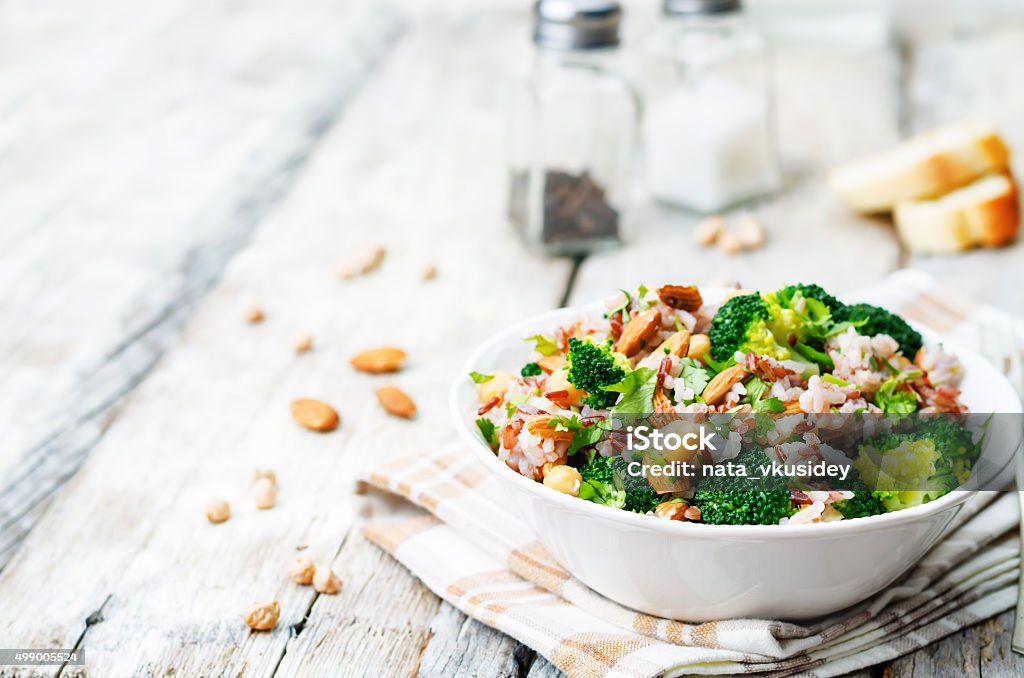 broccoli chickpea cilantro almond white and red rice broccoli chickpea cilantro almond white and red rice. toning. selective Focus Vegan Food Stock Photo