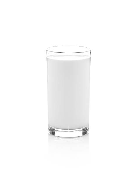 istock Glass of milk isolated on white 499005916