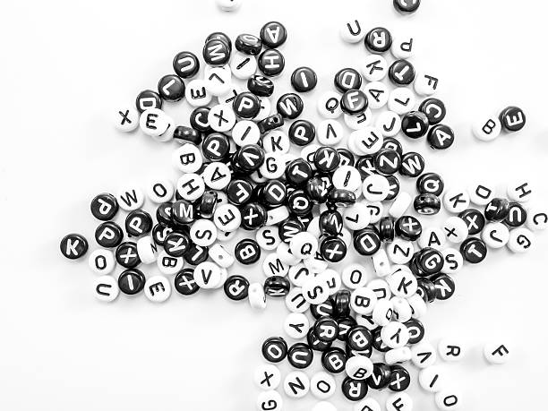 istock heap of round letters black and white pattern 499017580