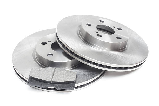 istock two brake discs and brake pads on a white background 499018154