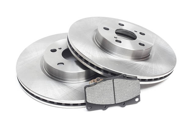 istock two brake discs and brake pads on a white background 499018174