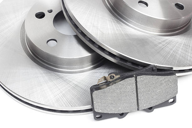 istock two brake discs and brake pads on a white background 499018204