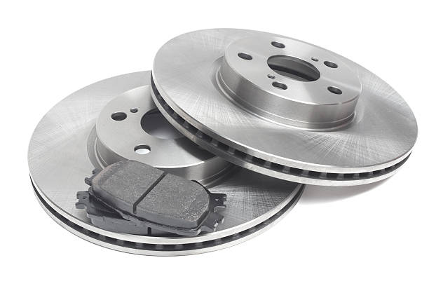istock two brake discs and brake pads on a white background 499018308