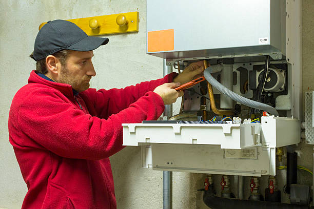 istock plumber repairing a condensing boiler 499018728