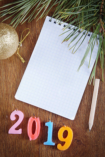 istock Festive background with blank notepad about Happy New Year 2019 499019034