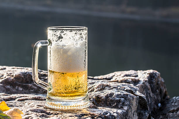 istock Mug of excellent beer sparkles on a rock 499019408
