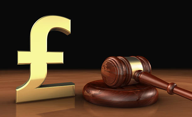 UK Pound Sterling And Law Symbol Cost Of Justice Concept stock photo