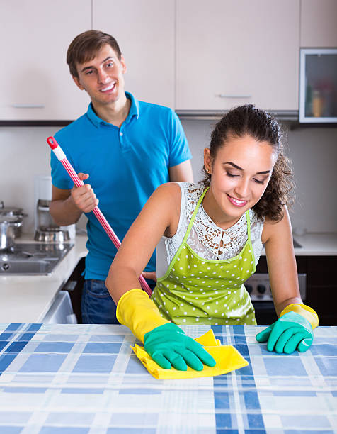 istock Young couple cleaning at kitchen 499020378
