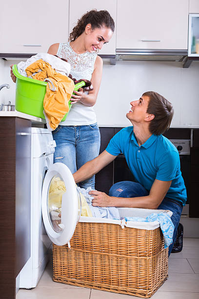 istock Couple near washing machine at home 499020504