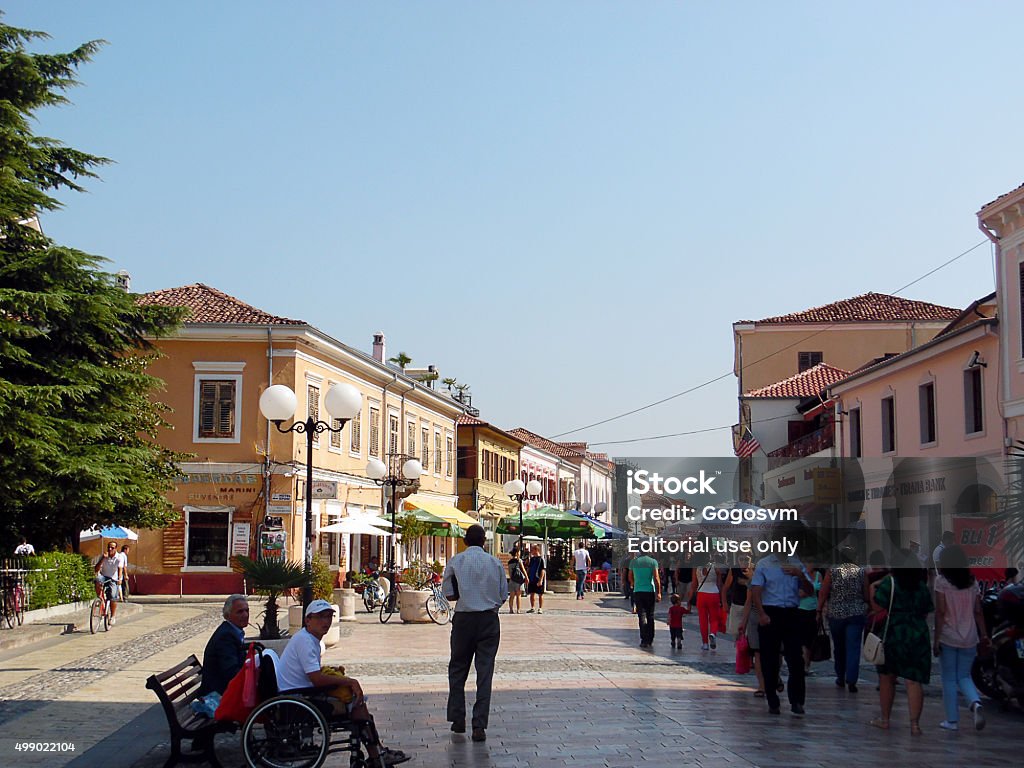 Shkoder Downtown Shkoder, Albania - September 3, 2015: People on Pedestrian street in Skodra - Albania. Advertisement signs and boards are visible and. Lot of pedestrians walk by. Faces recognisable. Shkoder Stock Photo