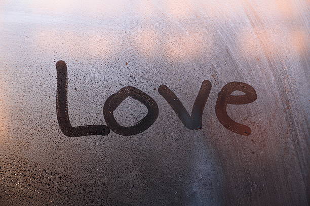 istock Word love written on glass 499028802