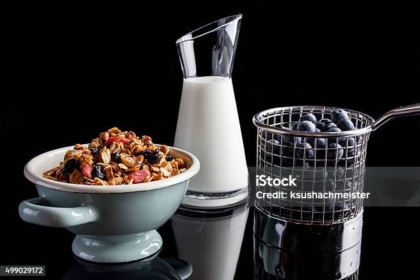 Blueberries Granola And Yogurt On Black From Side Stock Photo - Download Image Now - 2015, Berry Fruit, Black Background