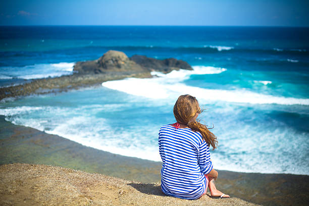 istock girl sitting on a mountain 499029503