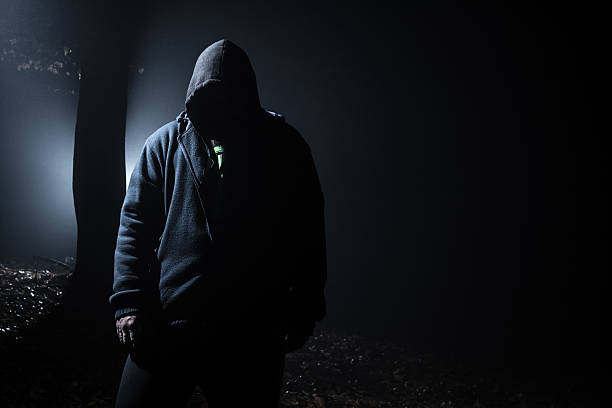 istock alien person in the dark forest 499029536