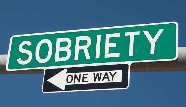 Sobriety highway sign Sobriety printed on green overhead highway sign with one way arrow sobriety stock pictures, royalty-free photos & images