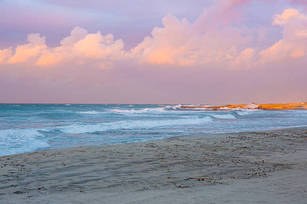 istock Clouds over the stormy sea and sunset 499030197
