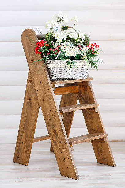 istock Flowers in basket on the ladder. 499030534