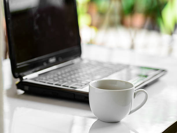 istock Coffee cup and laptop for business, Selective focus on coffee. 499030639