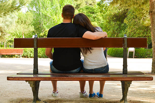 istock Young couple enjoying day in a park 499031115