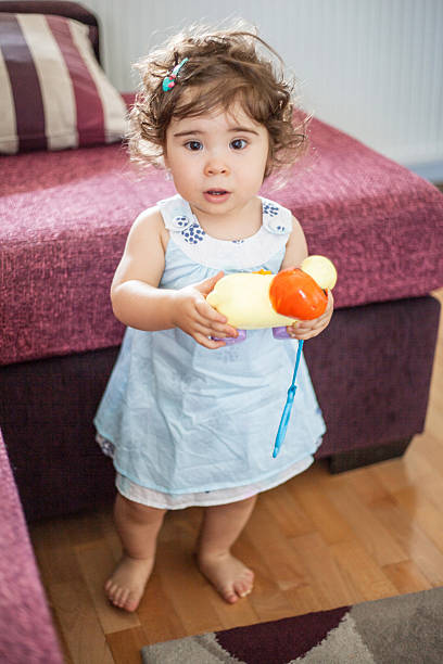 istock Little girl playing 499031152