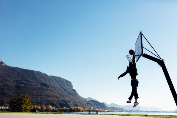 istock Man dunks basketball in the hoop 499031554