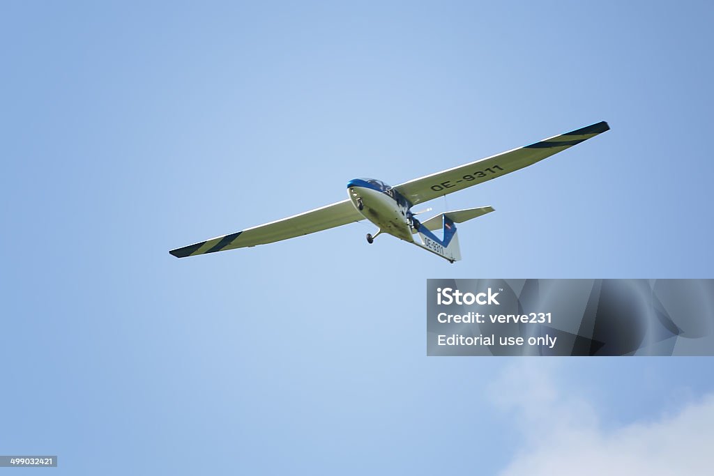 Glider during the course of training exercise Leoben, Austria - July 14, 2013: Glider during the course of training exercise flying against blue sky in Leoben, Austria. Flying Stock Photo