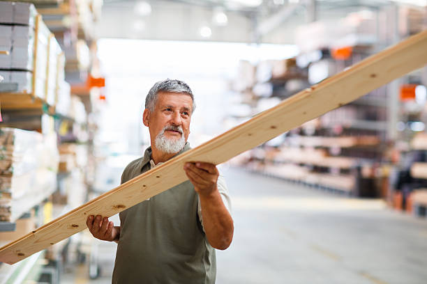 istock Senior man buying construction wood in a  DIY store 499032499
