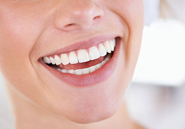 Cropped photo of attractive young woman teeth growl beaming dressed stylish white clothes isolated on khaki color background.