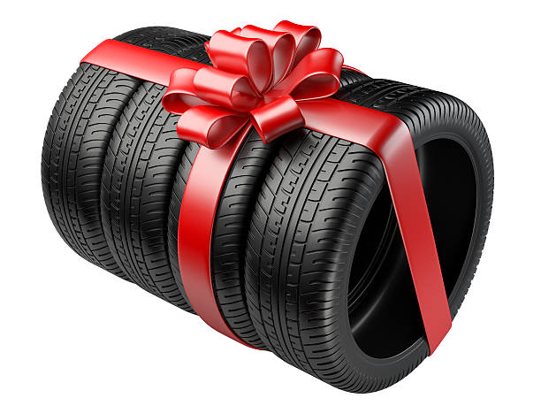 istock Gift set four tyres with a wrapped red ribbon 499045796