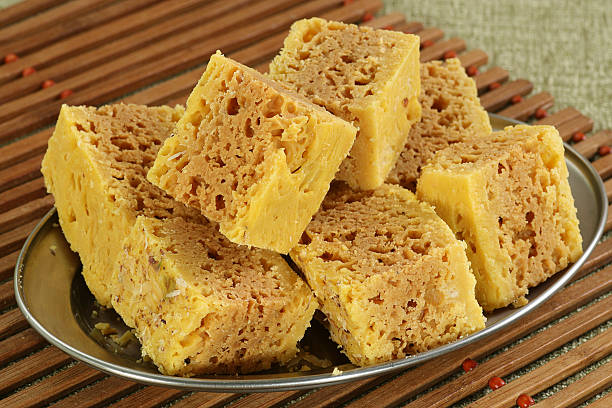 mysore pak delicious indian sweet on a silver dish mysore stock pictures, royalty-free photos & images