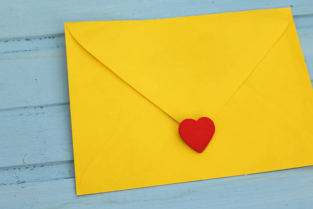 istock Yellow love letter on blue background 499047022
