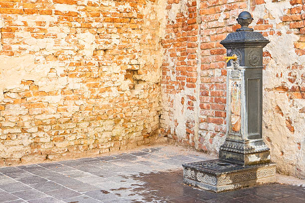Drink fountain in public space of an italian city - image with copy space
