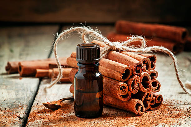 istock Essential cinnamon oil in a small bottle 499049134