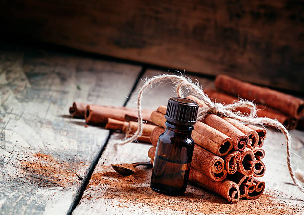 istock Essential cinnamon oil in a small bottle 499049324