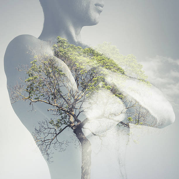 Strong sporty young man torso combined with green tree as lungs, double exposure photo