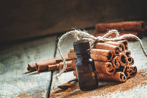 istock Essential cinnamon oil in a small bottle 499049436