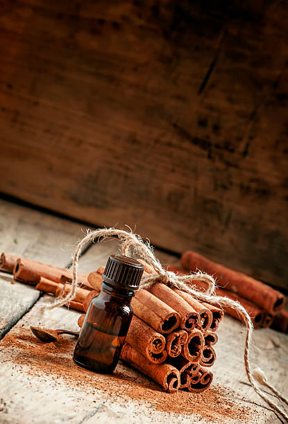 istock Essential cinnamon oil in a small bottle 499049544