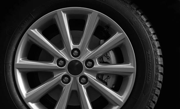istock Typical car wheel. No-name winter tire on alloy rim. 499049552