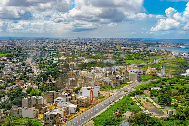 Overview of Dakar from the observation deck Aerial view to Dakar and shore of Atlantic ocean from observation deck of African Renaissance Monument through glass senegal photos stock pictures, royalty-free photos & images