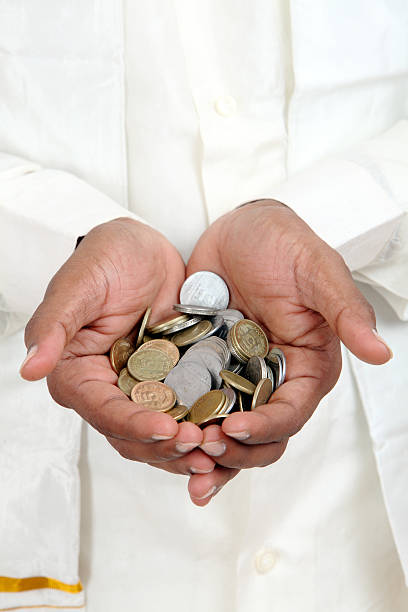 istock Businessman hand with Indian rupee coins. 499052156
