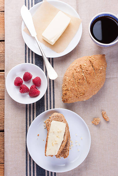 istock homemade oatmeal bread with coffee, butter and raspberries 499052464