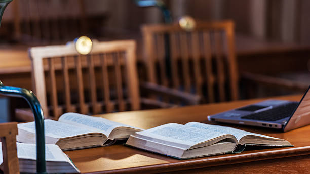 istock Books and laptop on a wooden table 499055376