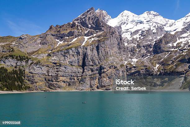 View Of Oeschinensee Lake With Bluemlisalp And Frundenhorn Alps Switzerland Stock Photo - Download Image Now