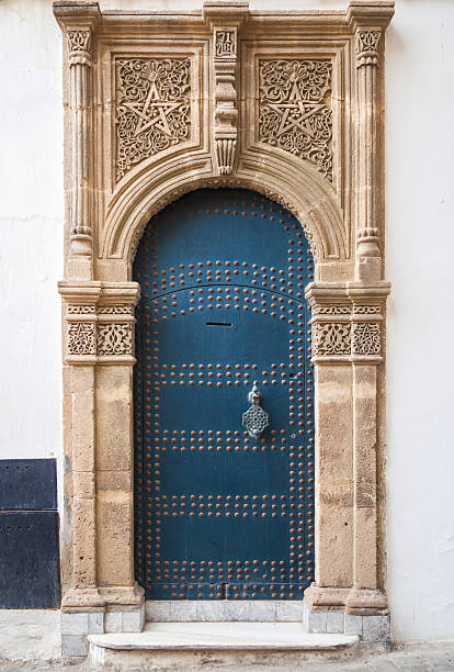 istock Ancient blue door with decoration. Tangier, Morocco 499055783
