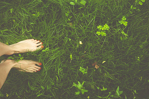 istock young woman standing on a grass 499056143