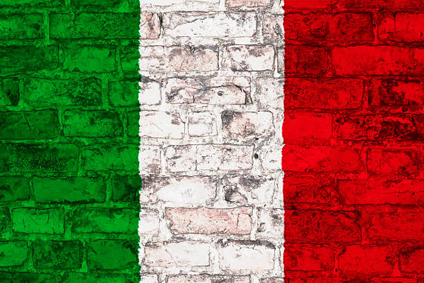 istock italian flag on brick wall 499056655