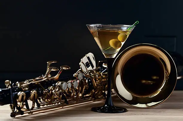Photo of saxophone and martini with green olives