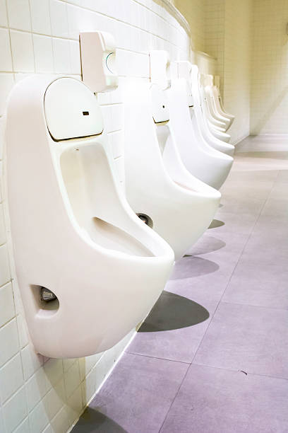 istock Many urinals in a public men's restroom 499059455